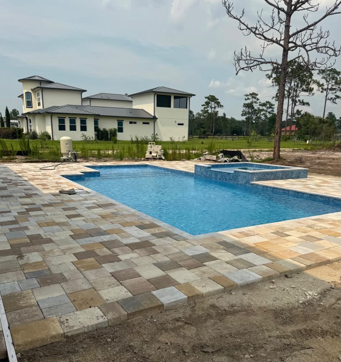 Pool deck with mixed pavers under construction