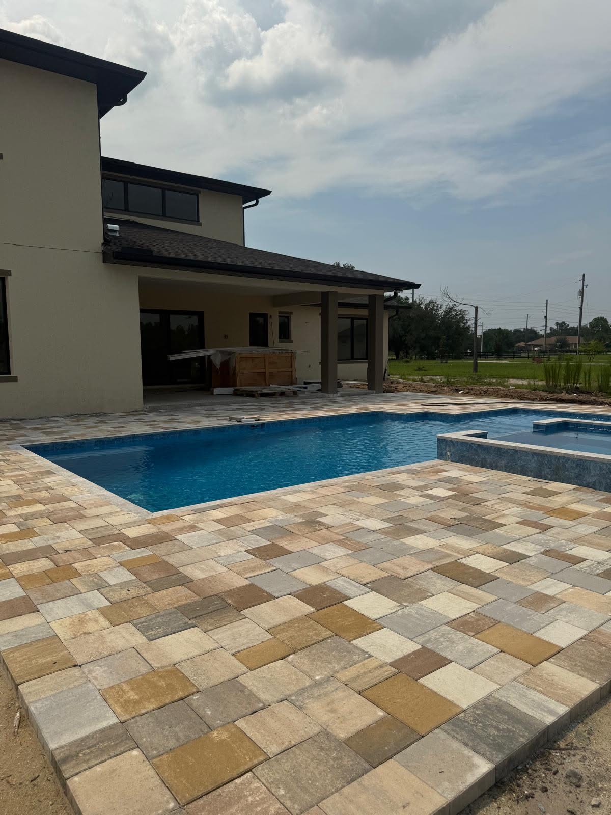 Pool patio with pavers from wide angle view