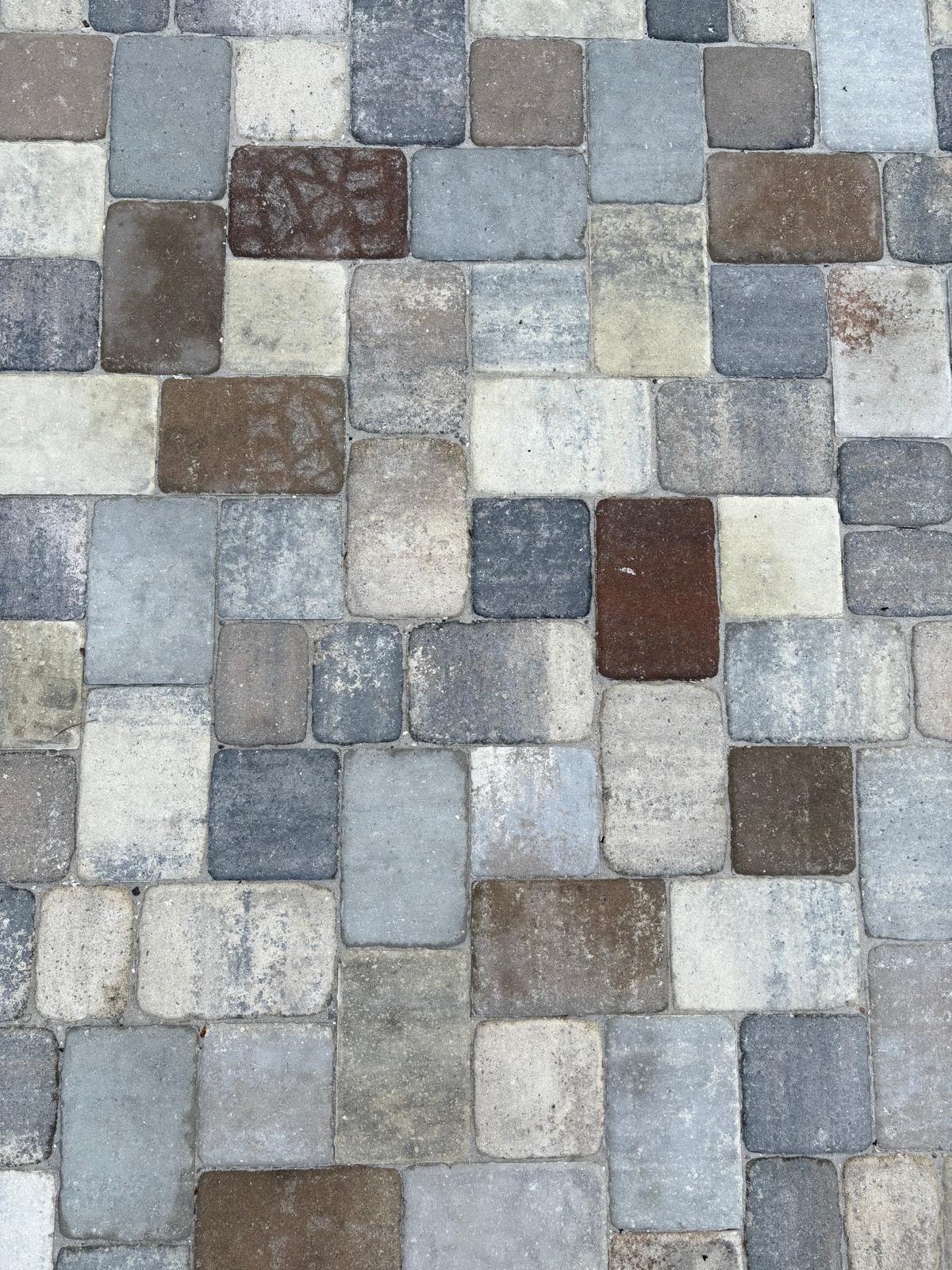 Close-up of mixed color cobblestone paver pattern