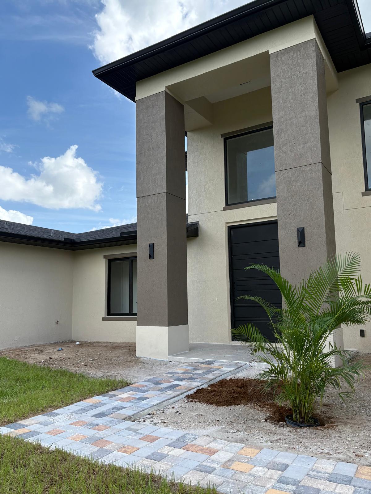 Paver walkway installation with surrounding trees
